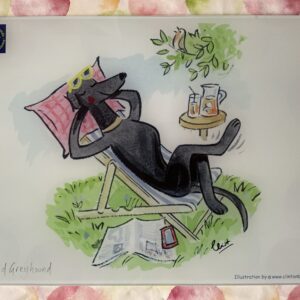 Retired Greyhound in deckchair with Pina Colada chopping board